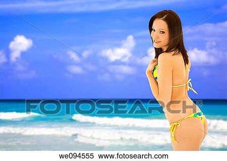 Beautiful and sexy caucasian woman in her early 20s posing in a Brazilian thong bikini with the turquoise waters and white sand beaches of Rio de Janeiro Brazil View Large Photo Image Stock Photography - Beautiful and sexy caucasian woman in her early 20s posing in a Brazilian thong bikini with the turquoise waters and white sand beaches of Rio de Janeiro Brazil. Fotosearch