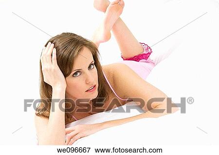 Beautiful and sexy Caucasian woman laying in bed View Large Photo Image Stock Photo - Beautiful and sexy Caucasian woman laying in bed. Fotosearch