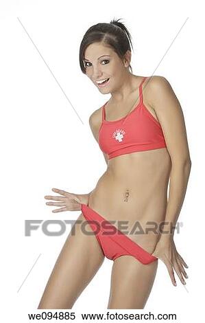 Beautiful and sexy Caucasian woman posing in a red lifeguard swinsuit View Large Photo Image Stock Photography - Beautiful and sexy Caucasian woman posing in a red lifeguard swinsuit. Fotosearch