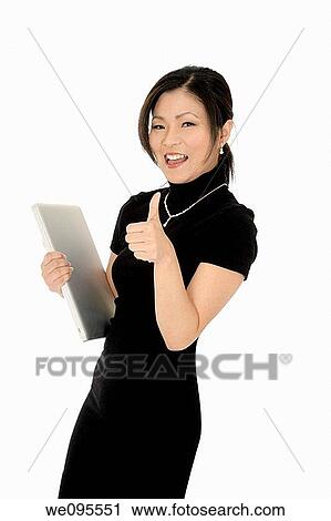 Beautiful Asian businesswoman giving the thumbs up or the ok sign View Large Photo Image Stock Image - Beautiful Asian businesswoman giving the thumbs up or the ok sign. Fotosearch