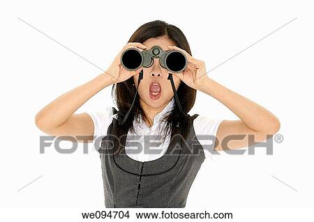 Beautiful Asian businesswoman holding a pair of binocular on a white background View Large Photo Image Picture - Beautiful Asian businesswoman holding a pair of binocular on a white background. Fotosearch