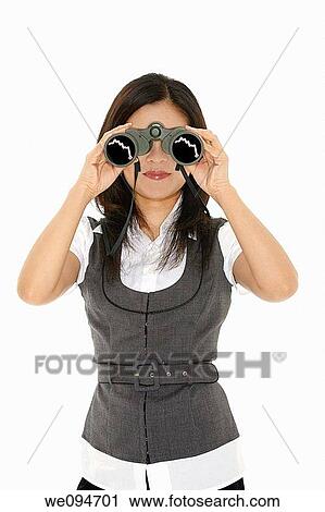 Beautiful Asian businesswoman holding a pair of binocular on a white background View Large Photo Image Stock Image - Beautiful Asian businesswoman holding a pair of binocular on a white background. Fotosearch