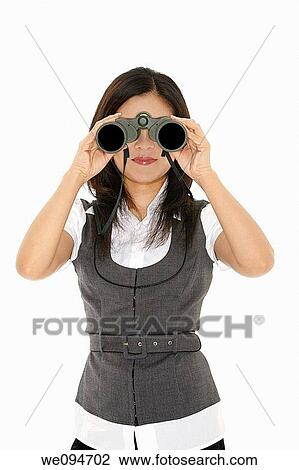 Beautiful Asian businesswoman holding a pair of binocular on a white background View Large Photo Image Stock Image - Beautiful Asian businesswoman holding a pair of binocular on a white background. Fotosearch