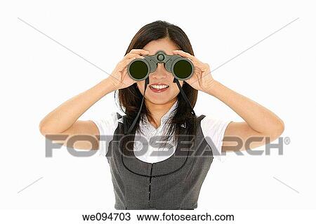 Beautiful Asian businesswoman holding a pair of binocular on a white background View Large Photo Image Stock Image - Beautiful Asian businesswoman holding a pair of binocular on a white background. Fotosearch