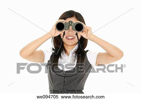 Beautiful Asian businesswoman holding a pair of binocular on a white background View Large Photo Image Stock Photography - Beautiful Asian businesswoman holding a pair of binocular on a white background. Fotosearch