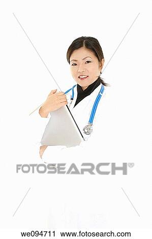 Beautiful Asian doctor or nurse holding a laptop computer View Large Photo Image Stock Image - Beautiful Asian doctor or nurse holding a laptop computer. Fotosearch