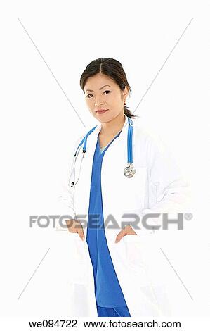 Beautiful Asian doctor or nurse on a white background View Large Photo Image Stock Image - Beautiful Asian doctor or nurse on a white background. Fotosearch