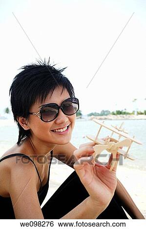 Beautiful asian woman looking at camera View Large Photo Image Stock Photograph - Beautiful asian woman looking at camera. Fotosearch