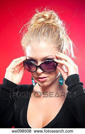 beautiful blond shot against red background View Large Photo Image Stock Photo - beautiful blond shot against red background. Fotosearch