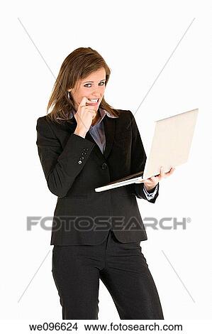 Beautiful Caucasian business holding a laptop computer View Large Photo Image Picture - Beautiful Caucasian business holding a laptop computer. Fotosearch