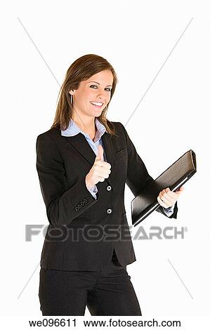 Beautiful Caucasian business holding a laptop computer View Large Photo Image Stock Image - Beautiful Caucasian business holding a laptop computer. Fotosearch