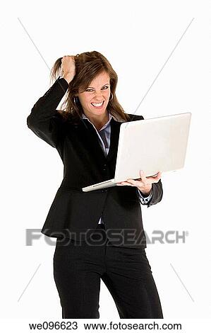 Beautiful Caucasian business holding a laptop computer View Large Photo Image Stock Image - Beautiful Caucasian business holding a laptop computer. Fotosearch
