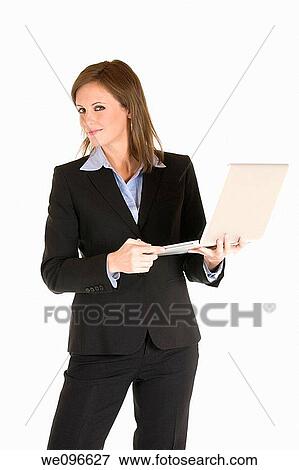 Stock Photo - Beautiful Caucasian business holding a laptop computer. Fotosearch