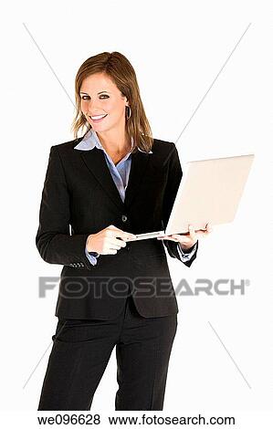 Beautiful Caucasian business holding a laptop computer View Large Photo Image Stock Photo - Beautiful Caucasian business holding a laptop computer. Fotosearch