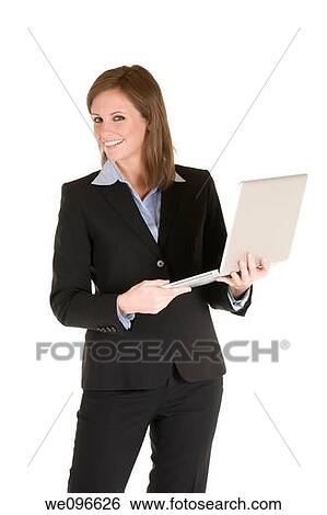 Beautiful Caucasian business holding a laptop computer View Large Photo Image Stock Photograph - Beautiful Caucasian business holding a laptop computer. Fotosearch
