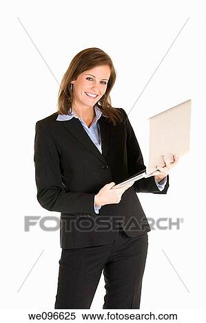 Beautiful Caucasian business holding a laptop computer View Large Photo Image Stock Photography - Beautiful Caucasian business holding a laptop computer. Fotosearch