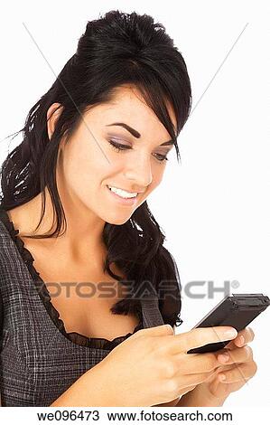 Beautiful Caucasian business woman using a pda while standing on white background View Large Photo Image Stock Image - Beautiful Caucasian business woman using a pda while standing on white background. Fotosearch