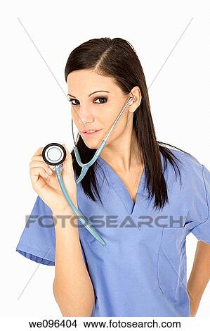 Beautiful Caucasian doctor / nurse standing on white background View Large Photo Image Picture - Beautiful Caucasian doctor / nurse standing on white background. Fotosearch