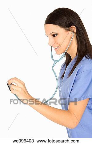 Beautiful Caucasian doctor / nurse standing on white background View Large Photo Image Stock Image - Beautiful Caucasian doctor / nurse standing on white background. Fotosearch