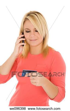 Beautiful Caucasian female using a credit card to make a purchase View Large Photo Image Stock Photo - Beautiful Caucasian female using a credit card to make a purchase. Fotosearch