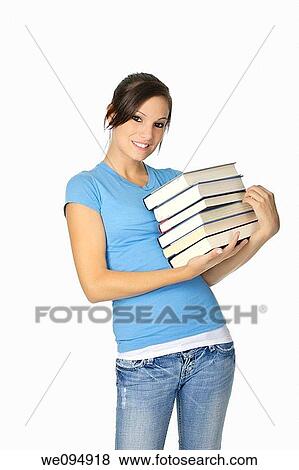 Beautiful Caucasian student with a hand full of books View Large Photo Image Stock Photo - Beautiful Caucasian student with a hand full of books. Fotosearch