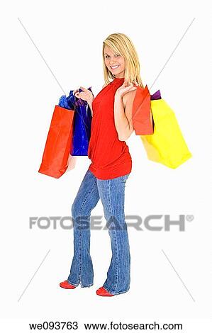 Beautiful Caucasian teen holding shopping bags while standing on a white background View Large Photo Image Stock Image - Beautiful Caucasian teen holding shopping bags while standing on a white background. Fotosearch
