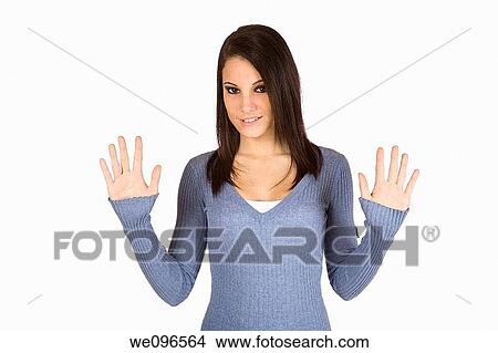 Beautiful Caucasian teenager counting on fingers on green background View Large Photo Image Picture - Beautiful Caucasian teenager counting on fingers on green background. Fotosearch
