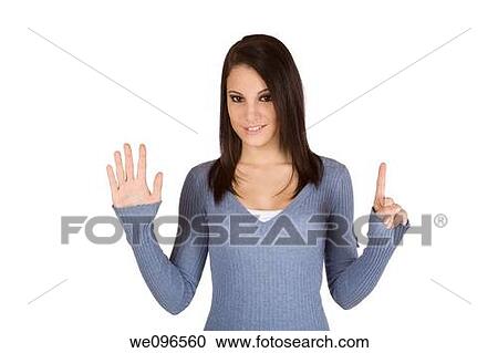 Beautiful Caucasian teenager counting on fingers on green background View Large Photo Image Stock Image - Beautiful Caucasian teenager counting on fingers on green background. Fotosearch
