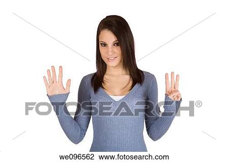 Beautiful Caucasian teenager counting on fingers on green background View Large Photo Image Stock Image - Beautiful Caucasian teenager counting on fingers on green background. Fotosearch