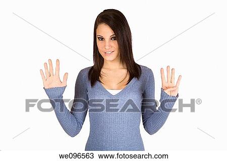 Beautiful Caucasian teenager counting on fingers on green background View Large Photo Image Stock Image - Beautiful Caucasian teenager counting on fingers on green background. Fotosearch