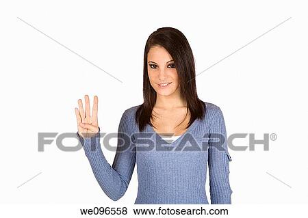 Beautiful Caucasian teenager counting on fingers on green background View Large Photo Image Stock Photo - Beautiful Caucasian teenager counting on fingers on green background. Fotosearch