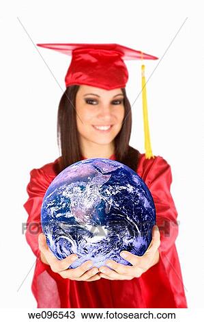 Beautiful Caucasian teenager in a graduation gown holding the world View Large Photo Image Stock Image - Beautiful Caucasian teenager in a graduation gown holding the world. Fotosearch