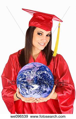 Beautiful Caucasian teenager in a graduation gown holding the world View Large Photo Image Stock Photo - Beautiful Caucasian teenager in a graduation gown holding the world. Fotosearch