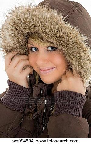 Beautiful caucasian teenager standing on white background smiling with some attitude View Large Photo Image Picture - Beautiful caucasian teenager standing on white background smiling with some attitude. Fotosearch