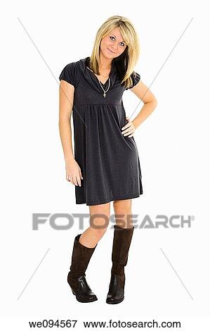 Beautiful caucasian teenager standing on white background smiling with some attitude View Large Photo Image Stock Photo - Beautiful caucasian teenager standing on white background smiling with some attitude. Fotosearch