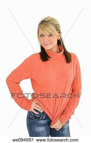 Beautiful caucasian teenager standing on white background smiling with some attitude View Large Photo Image Stock Photo - Beautiful caucasian teenager standing on white background smiling with some attitude. Fotosearch