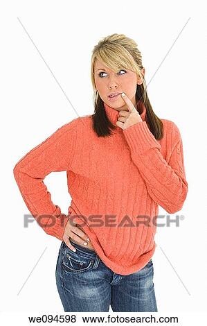 Beautiful caucasian teenager standing on white background thinking with some attitude View Large Photo Image Stock Photo - Beautiful caucasian teenager standing on white background thinking with some attitude. Fotosearch