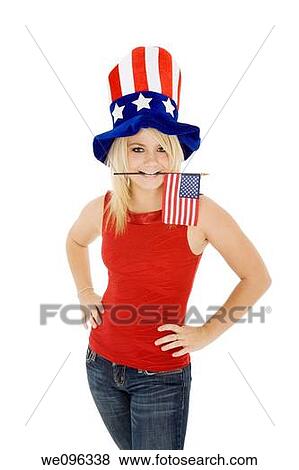 Stock Photo - Beautiful Caucasian woman celibrating the 4th of July. Fotosearch