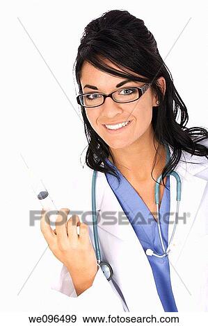 Beautiful Caucasian woman doctor holding a syringe View Large Photo Image Stock Photo - Beautiful Caucasian woman doctor holding a syringe. Fotosearch