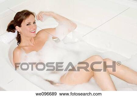 Beautiful Caucasian woman enjoying a nice bubble bath View Large Photo Image Stock Photo - Beautiful Caucasian woman enjoying a nice bubble bath. Fotosearch