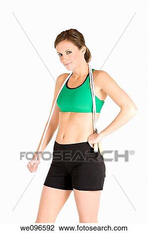 Beautiful Caucasian woman holding a jump rope in fitness clothes View Large Photo Image Stock Image - Beautiful Caucasian woman holding a jump rope in fitness clothes. Fotosearch