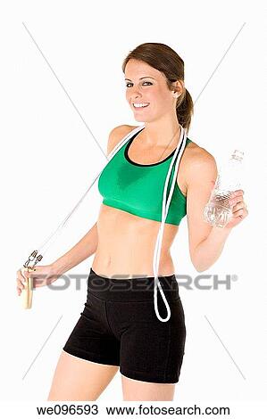 Beautiful Caucasian woman holding a jump rope in fitness clothes View Large Photo Image Stock Image - Beautiful Caucasian woman holding a jump rope in fitness clothes. Fotosearch