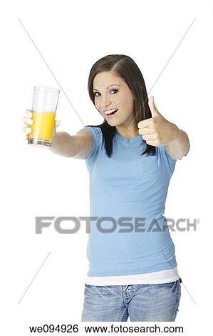 Beautiful Caucasian woman holding a glass of orange juice View Large Photo Image Stock Photograph - Beautiful Caucasian woman holding a glass of orange juice. Fotosearch