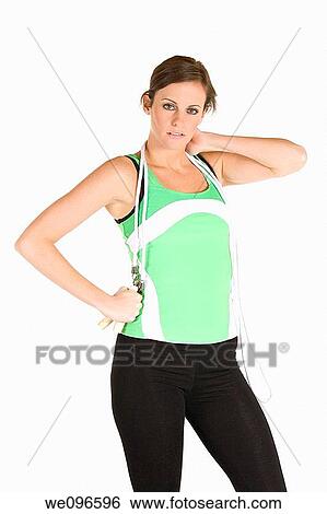 Beautiful Caucasian woman holding a jump rope in fitness clothes View Large Photo Image Stock Photograph - Beautiful Caucasian woman holding a jump rope in fitness clothes. Fotosearch