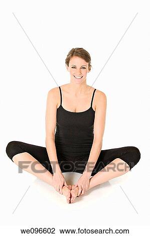 Beautiful Caucasian woman practicing Yoda on a white background View Large Photo Image Stock Image - Beautiful Caucasian woman practicing Yoda on a white background. Fotosearch