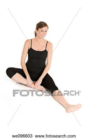 Beautiful Caucasian woman practicing Yoda on a white background View Large Photo Image Stock Image - Beautiful Caucasian woman practicing Yoda on a white background. Fotosearch