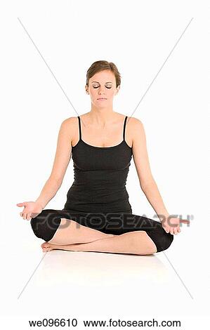 Beautiful Caucasian woman practicing Yoda on a white background View Large Photo Image Stock Image - Beautiful Caucasian woman practicing Yoda on a white background. Fotosearch