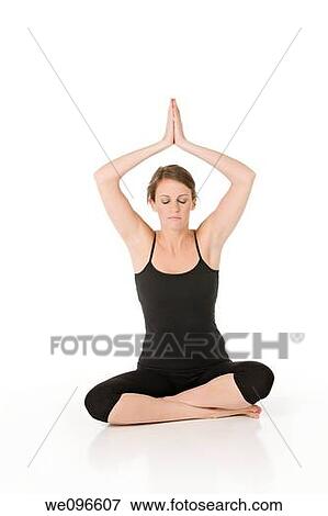 Beautiful Caucasian woman practicing Yoda on a white background View Large Photo Image Stock Photo - Beautiful Caucasian woman practicing Yoda on a white background. Fotosearch