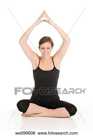 Stock Photo - Beautiful Caucasian woman practicing Yoda on a white background. Fotosearch