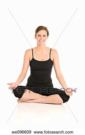 Beautiful Caucasian woman practicing Yoda on a white background View Large Photo Image Stock Photo - Beautiful Caucasian woman practicing Yoda on a white background. Fotosearch